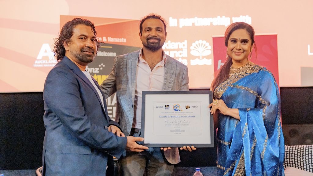 Forum Films director Pritesh Raniga and Tātaki Auckland Unlimited Festival Event Manager Arnav Taode present Meenakshi Sheshadri with the Legend of Indian Cinema Award. (Supplied photo)