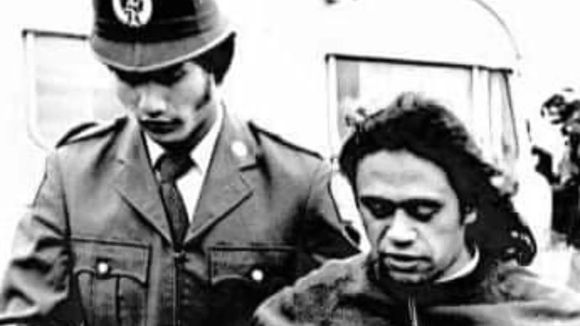 A man is taken away during a dawn raid in the 20th century. (Supplied by Vaafusaga Tupuola Masunu Tuisila)