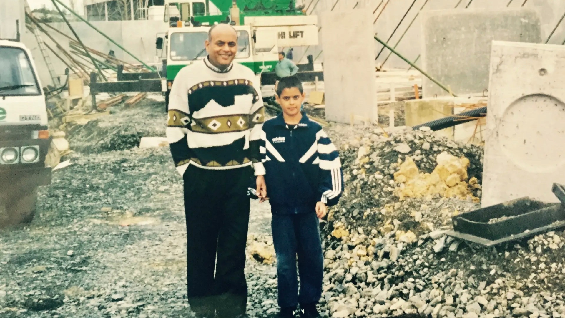 Dhiru Bhikha and his son Raj in front of the building site for Horners' Auckland factory, which opened in 1999. (Supplied photo)