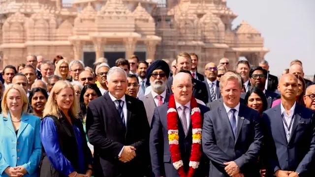 Priyanca Radhakrishnan (behind trade minister Todd McClay) in a group photo at New Delhi's Swaminarayan Akshardham Temple in March 2025. (Pool)